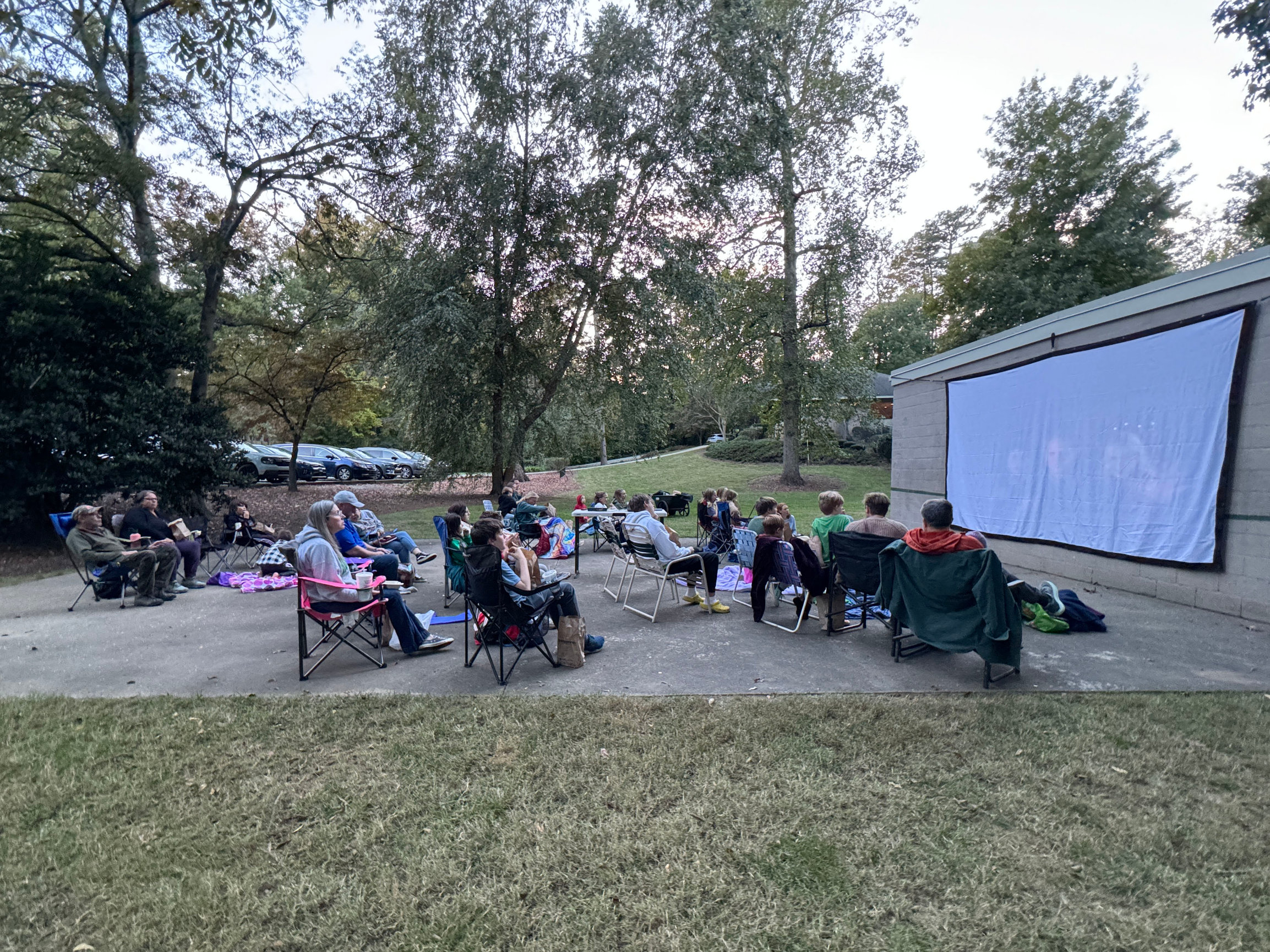 Photo of Friendly members watching a movie in Fall 2024 at the pool.